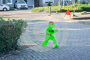 Fluorescent figure to warn traffic in a street