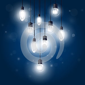 Luminous light bulbs hanging on cords - lamps photo
