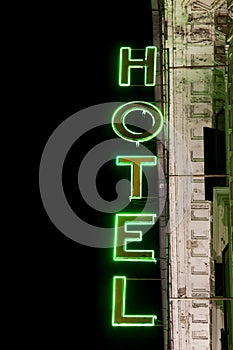 Luminous neon lights. Hotel Sign. Vertical.