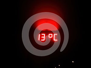 Luminous sign of temperature at night photo