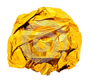 A lump or ball of crumpled yellow golden foil on a white background. Foil