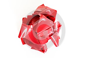 A lump of crumpled used red duct tape on white background