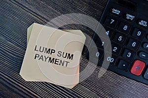 Lump Sum Payment write on sticky notes isolated on Wooden Table