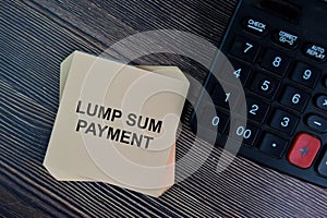 Lump Sum Payment write on sticky notes isolated on Wooden Table photo