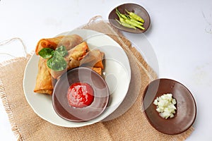 `Lumpia or lunpia, is traditional spring roll skin snack from Semarang, Indonesia. Traditional Spring rolls made eggs, and chicke