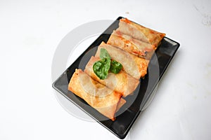 Lumpia or lunpia, is traditional spring roll skin snack from Semarang, Indonesia. Traditional Spring rolls made eggs, and chicken