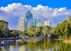 Lumpini Park , lake , modern apartments in downtown Bangkok