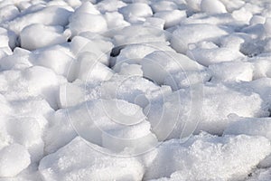 Lumps of snow and ice frazil on the surface of the freezing rive