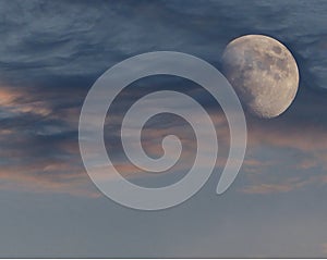 Lunar eclipse whit clouds in blue hour