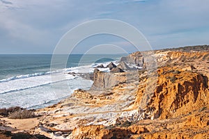 Lunar landscape with steep cliffs on the Atlantic coast in the Odemira region, western Portugal. Wandering along the Fisherman photo