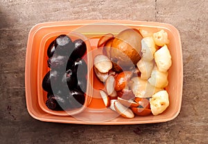 Lunch box contains tasty fruits for healthy diet