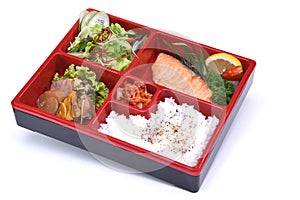 Lunch box of Roasted Salmon , Bento Salmon set isolated on white