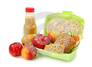 Lunch box with sandwich and fruits