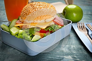 Lunch box with tasty sandwich