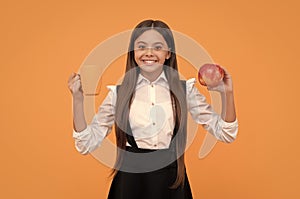 lunch break. kid keep water balance in body. happy teen girl with apple fruit and tea cup.