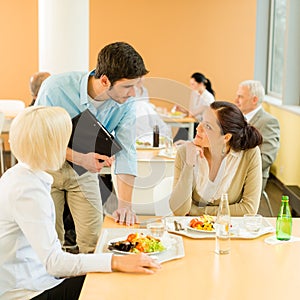Lunch break office colleagues eat salad cafeteria