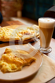 Lunch at a cafe. Khachapuri and latte