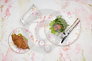 Lunch with croissant sandwich and salad