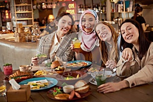 Lunch. Group Of Women In Cafe Portrait. Smiling Multicultural Girls With Cocktails.