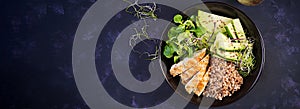 Lunch salad. Buddha bowl with buckwheat porridge, grilled chicken fillet, corn salad, microgreens and daikon. Healthy food. Top