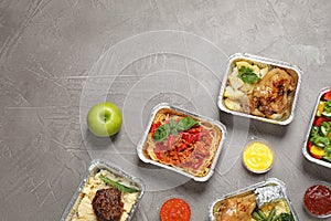 Lunchboxes on grey table. Healthy food delivery