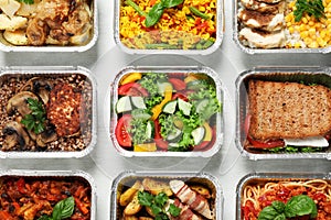 Lunchboxes on white wooden table, flat lay. Healthy food delivery