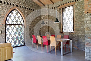 Lunchroom in a loft with two-tone chairs photo
