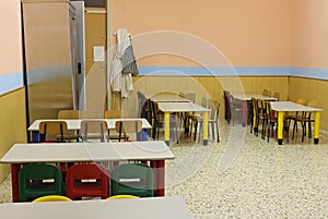 Lunchroom school without kids with colorful chairs and small tab