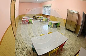 Lunchroom with small chairs and tables for a school for the chil photo