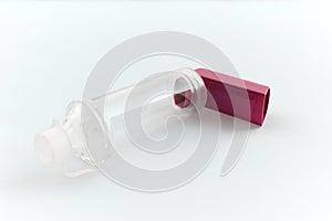 Lung medication with corticosteroids for asthma or COPD. An inhaler with spacer with white background photo