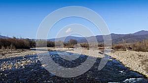 Lunigiana winter landscape view near Villafranca. Magra River and mountains behind. photo