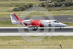 Luqa, Malta 18 April, 2015: Ambulance Learjet landing runway 31.