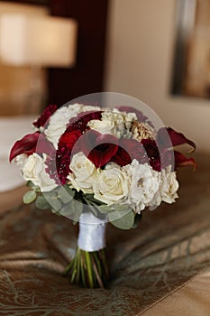Lush bridal bouquet of exotic flowers, closeup, blurred background. Concept wedding postcard. Luxury bridal bouquet with