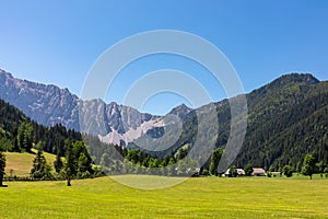 Bodental - Lush green alpine meadow of Maerchenwiese with panoramic view of Karawanks photo