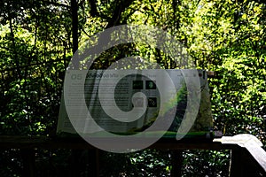 The sign, which features text in both Thai and English along with illustrations of various bird species