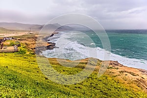 Lush green landscape and Seascape, Al Mughsayl Rocky Beach, Salalah, Oman