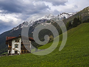 Lush green meadow,Idyllic spring mountain rural landscape. View over Stubaital or Stubai Valley near Innsbruck, Austria
