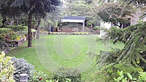 Lush green villa garden, pan landscape view