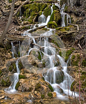 Lush moss covered waterfall in the Colorado Rocky Mountains