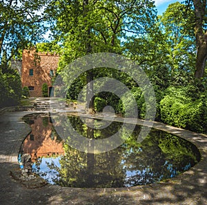 lush vegetation beautiful garden park Sigurta in Veneto , Italy , reflected pond