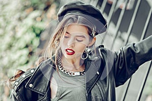 Lustful dark-haired model in black beret wearing red lipstick