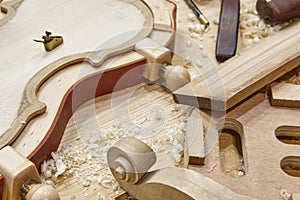 Luther workshop with violin parts and tools. Traditional craftsmanship