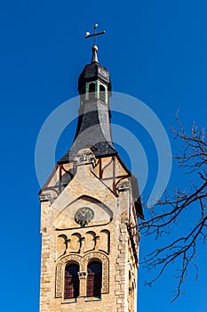 Lutheran church bell tower at 12:55 PM during early spring.