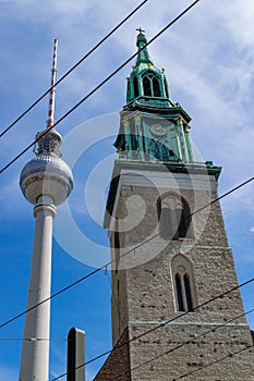 Lutheran Saint Mary`s church in Berlin in contrast with the needle tower of communications
