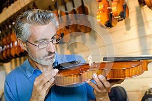 Luthier focused on job photo