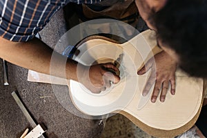 Luthier Making Guitar