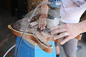 Luthier Using Power Tool to Build Handmade Wooden Electric Guitar