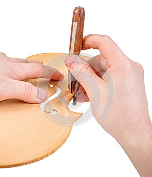 Luthier using the purfling-cutter