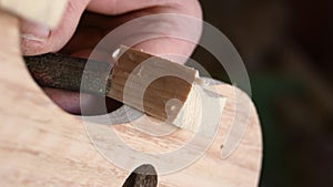 Luthier working in the structure of a new violin or viola