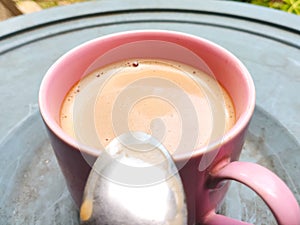 Luwak coffee in a pink cup